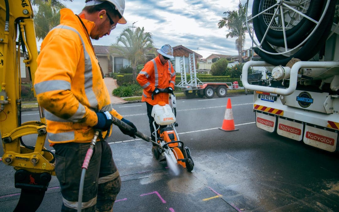 Concrete coring crew from Smartscan Locators using STIHL cutter and hydro-vac truck on a Sydney residential street.