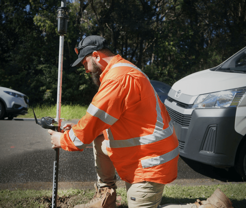 Utility Locating technician using GPS survey equipment on-site